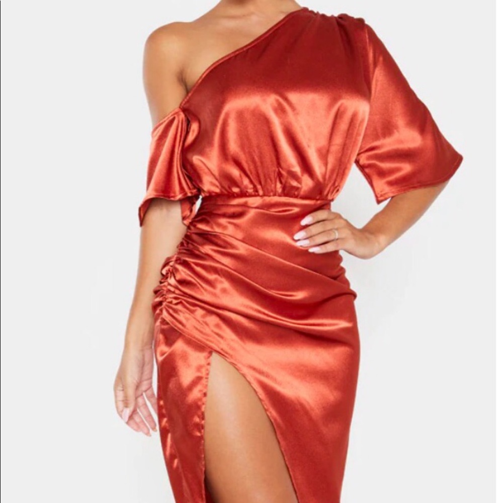 Burnt orange off the shoulder dress.